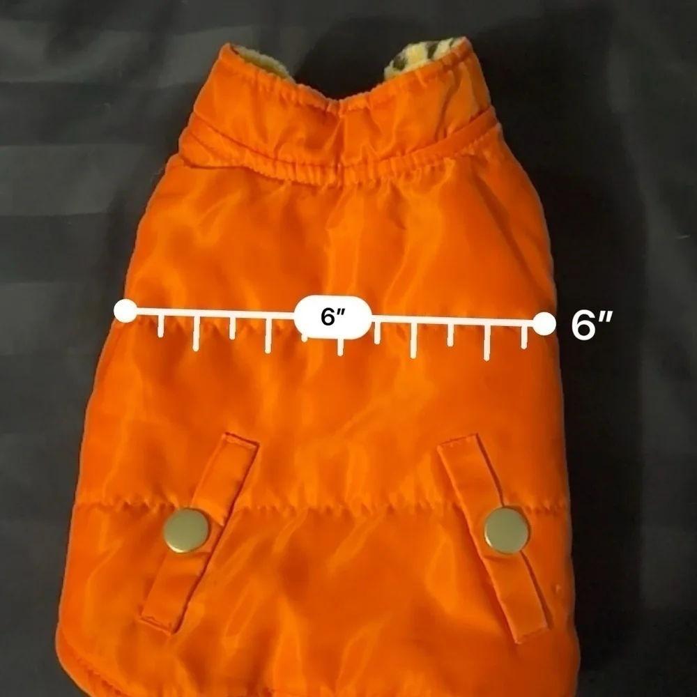 Small orange dog vest pockets are for decoration only.